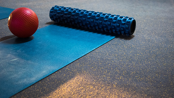 yoga mat and foam roller on Pliteq TREAD flooring