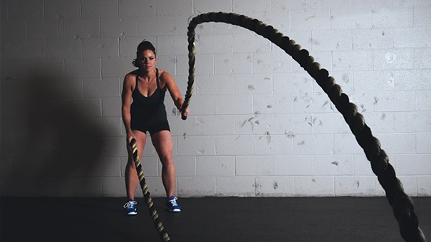 Woman using ropes to work out
