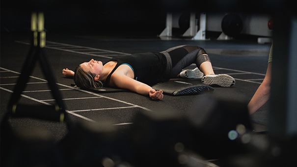 TREAD product used in fitness studio -woman stretching fitness facility